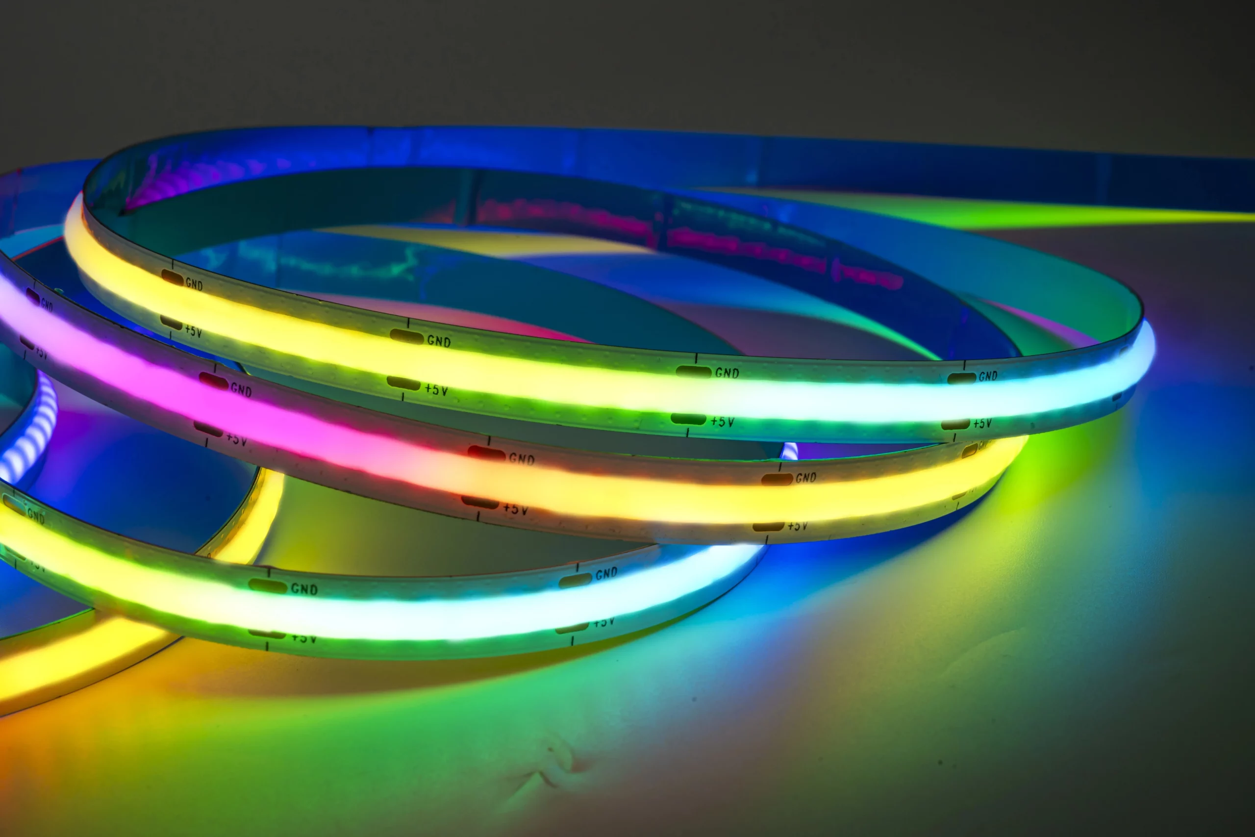 What is cob led strips? LED soft light strip is also called LED tape light strip, or flexible led light strips, and COB is the abbreviation of CHIP ON BOARD, which means that flip chip is arranged on the soft light strip, and the COB soft light strip looks like a soft tie Belt, with strong flexibility, folding and bending, there are light-emitting chips with small output power all over the surface, the overall light is uniform, soft and not dazzling, and the brightness is high. It usually replaces traditional lighting fixtures, so it is called LED COB Soft light strips. According to the different requirements of customers, various colors of light can be transmitted, The color tone is mild and beautiful, and it can be used as a simple lighting fixture or decorative design. COB FOB led light strip overall display, dotles cob led strip lights for lighting solutions.